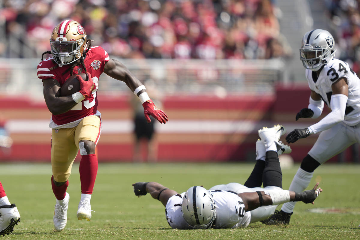 San Francisco 49ers running back JaMycal Hasty, left, runs for a touchdown against the Las Vega ...