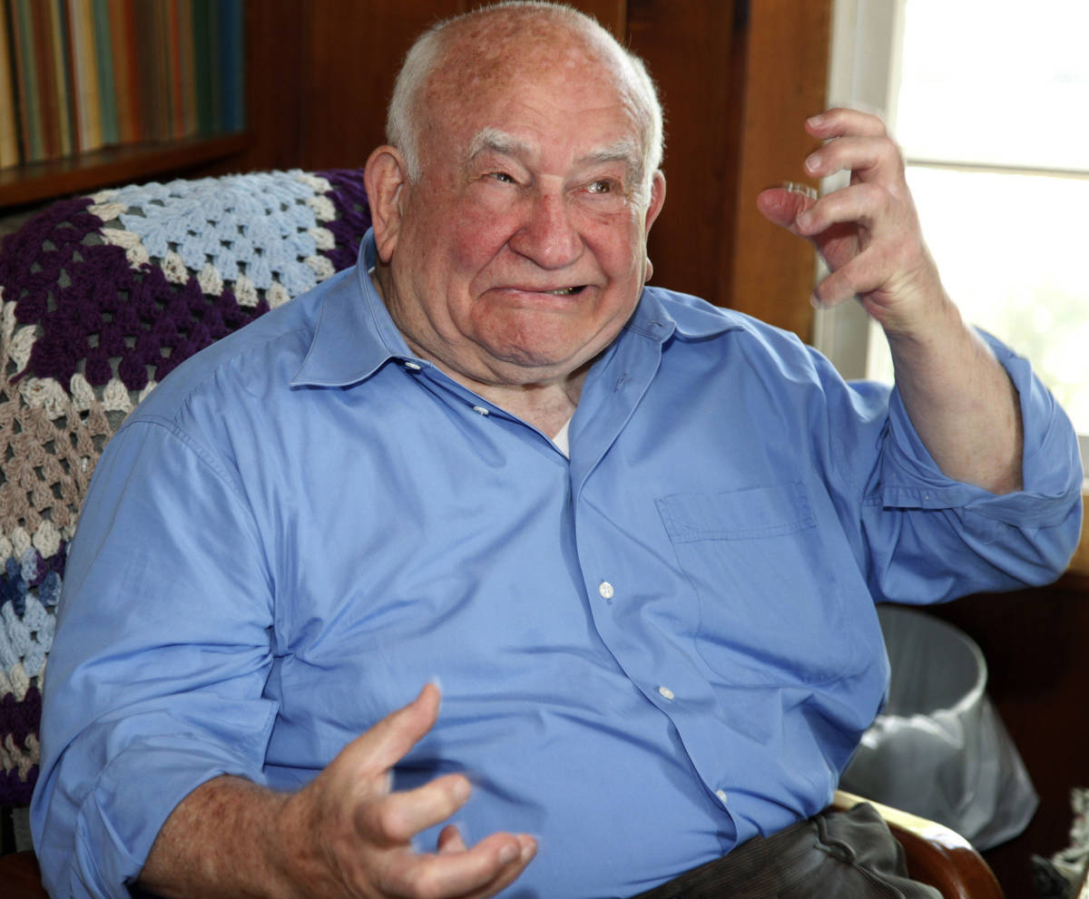FILE - In this May 6, 2009, file photo, actor Ed Asner jokes as he grimaces at his home in Vall ...