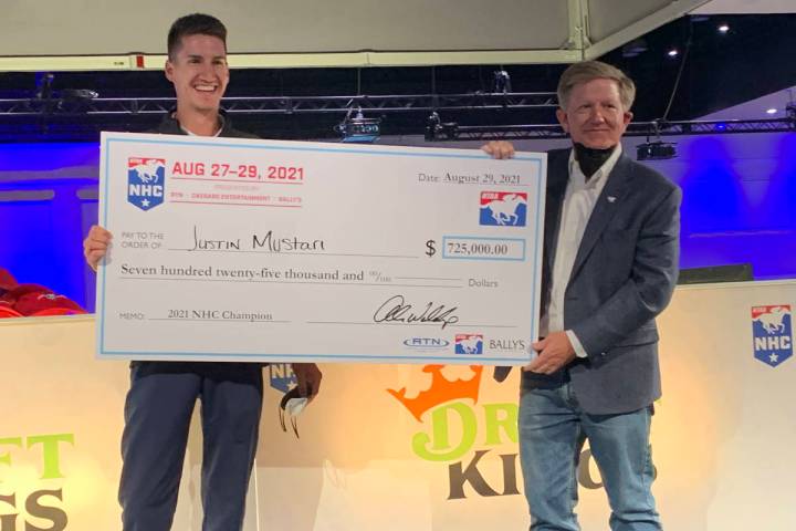 Justin Mustari, left, the youngest winner of the horse playing contest, poses with a replica ch ...