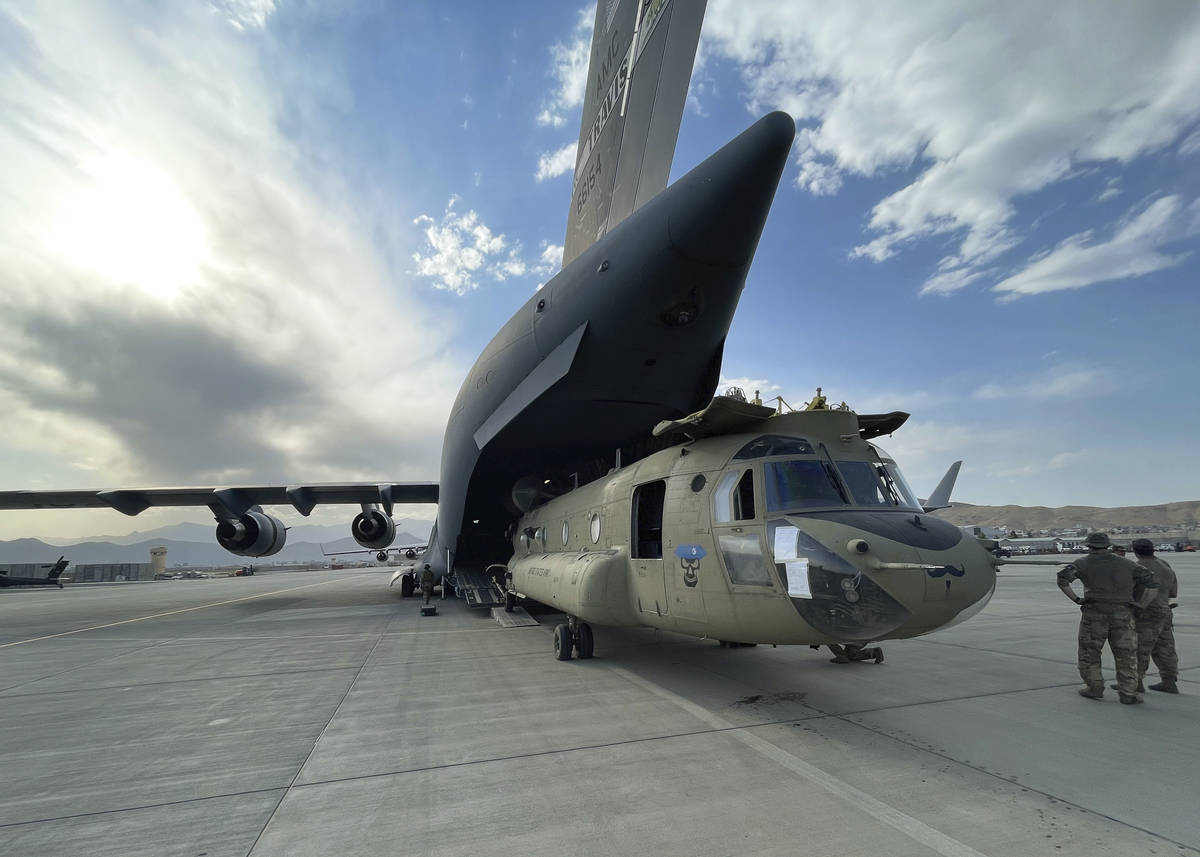 In this image provided by the Department of Defense, a CH-47 Chinook from the 82nd Combat Aviat ...