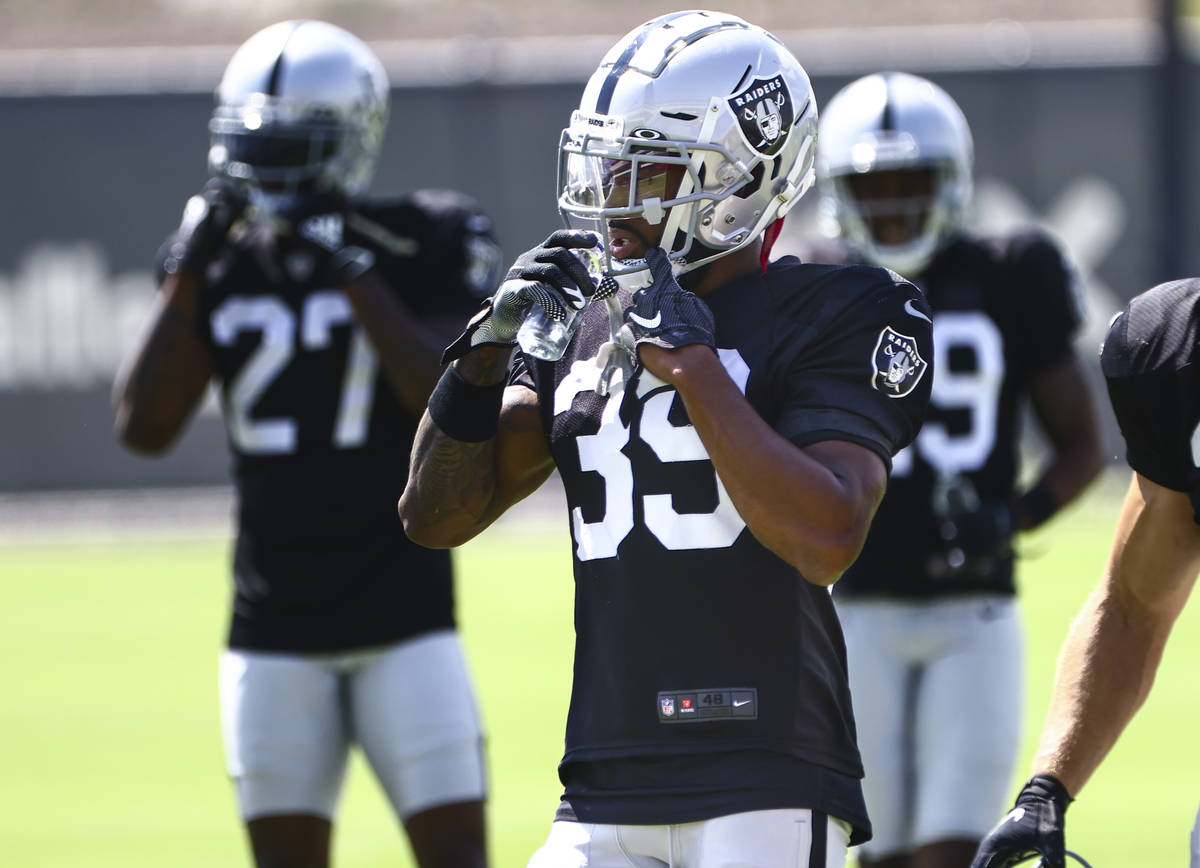 Raiders cornerback Nate Hobbs (39) hydrates during training camp at Raiders Headquarters/Interm ...