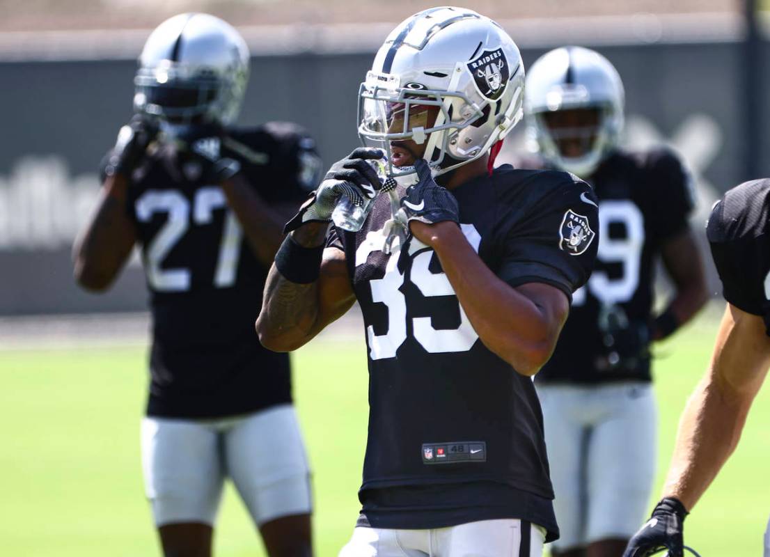 Raiders cornerback Nate Hobbs (39) hydrates during training camp at Raiders Headquarters/Interm ...