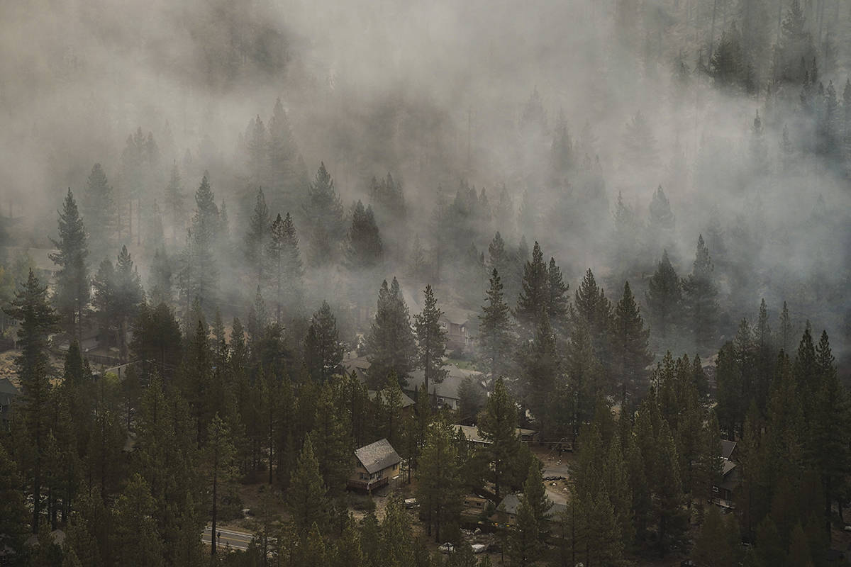 Smoke generated by the Caldor Fire fills the air in the Christmas Valley neighborhood of South ...