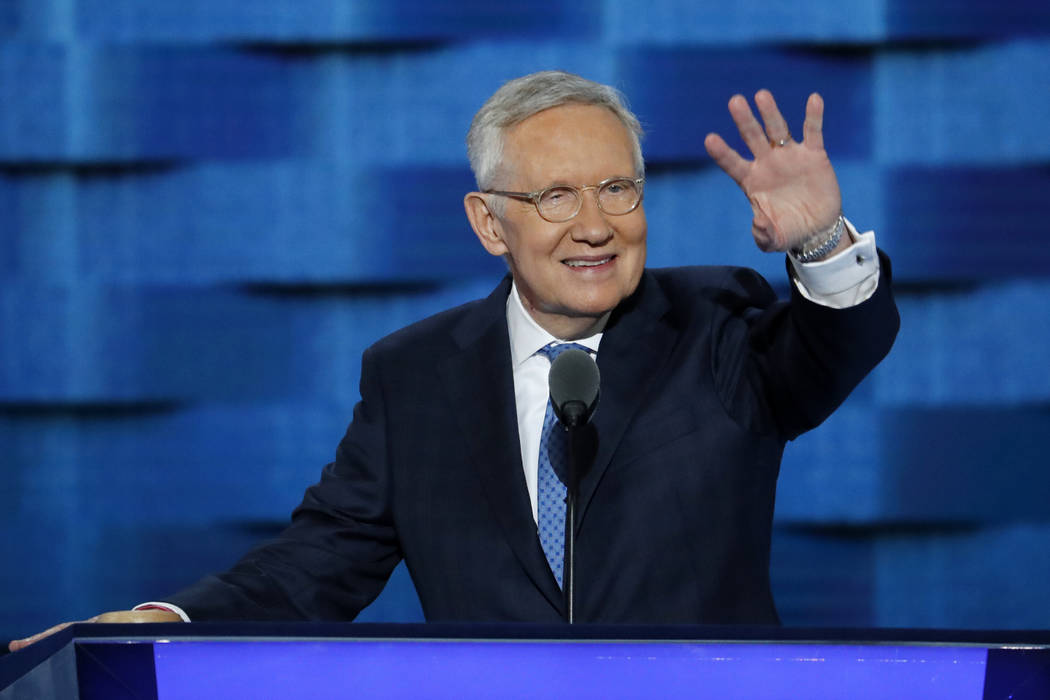 U.S. Senator Harry Reid, D-Nev., waves from the podium during the third day of the Democratic N ...