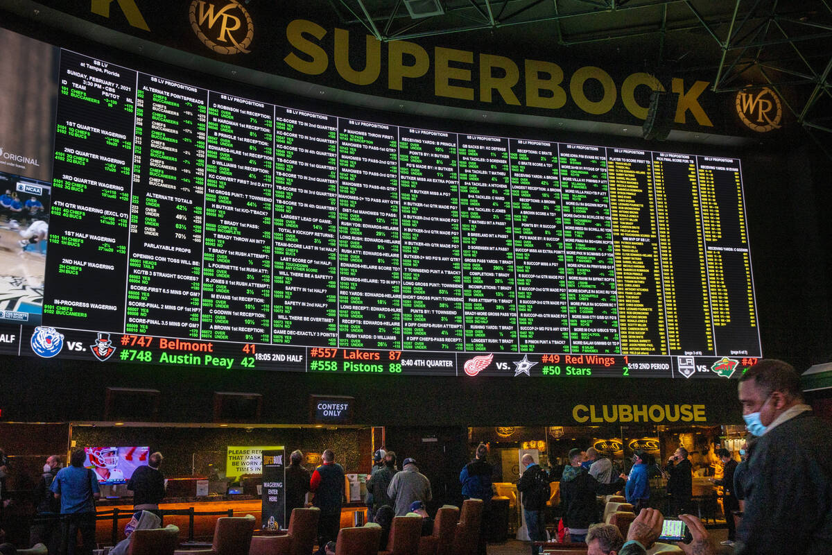 The Westgate sportsbook posts hundreds of Super Bowl prop bets and the line of bettors forms on ...