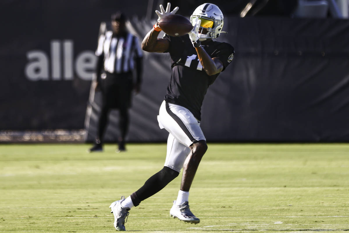 Raiders wide receiver Henry Ruggs III catches a pass during training camp at Raiders Headquarte ...