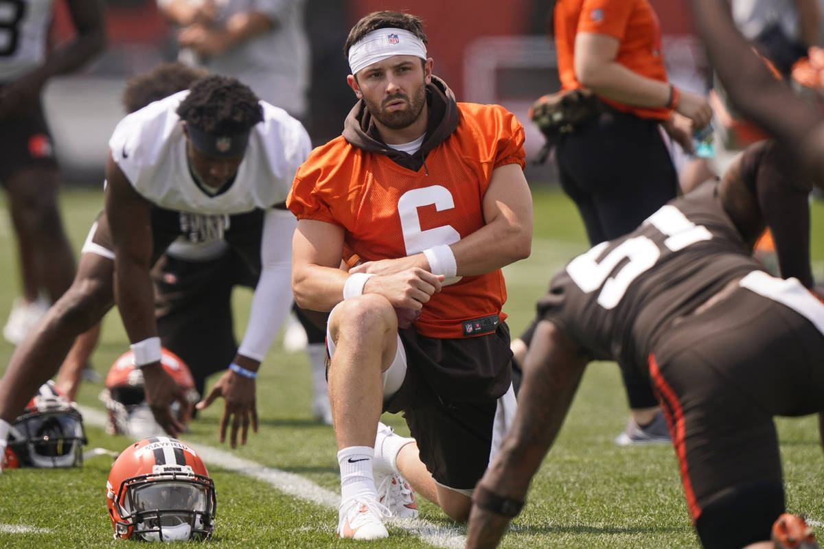 Cleveland Browns quarterback Baker Mayfield stretches during an NFL football practice, Saturday ...