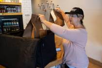 Michelle English, a delivery driver for Loco Co-Op, loads customers orders into insulated deliv ...