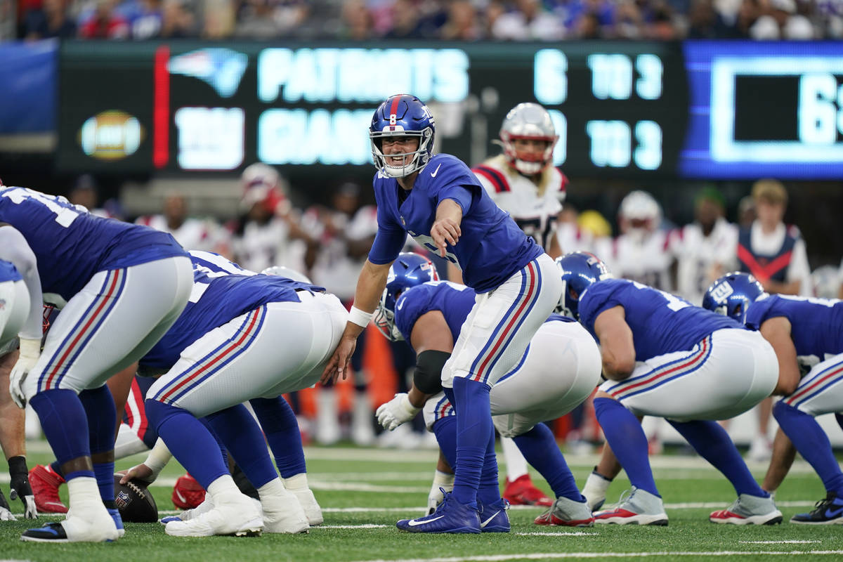 New York Giants quarterback Daniel Jones calls out to his team during the first half of an NFL ...