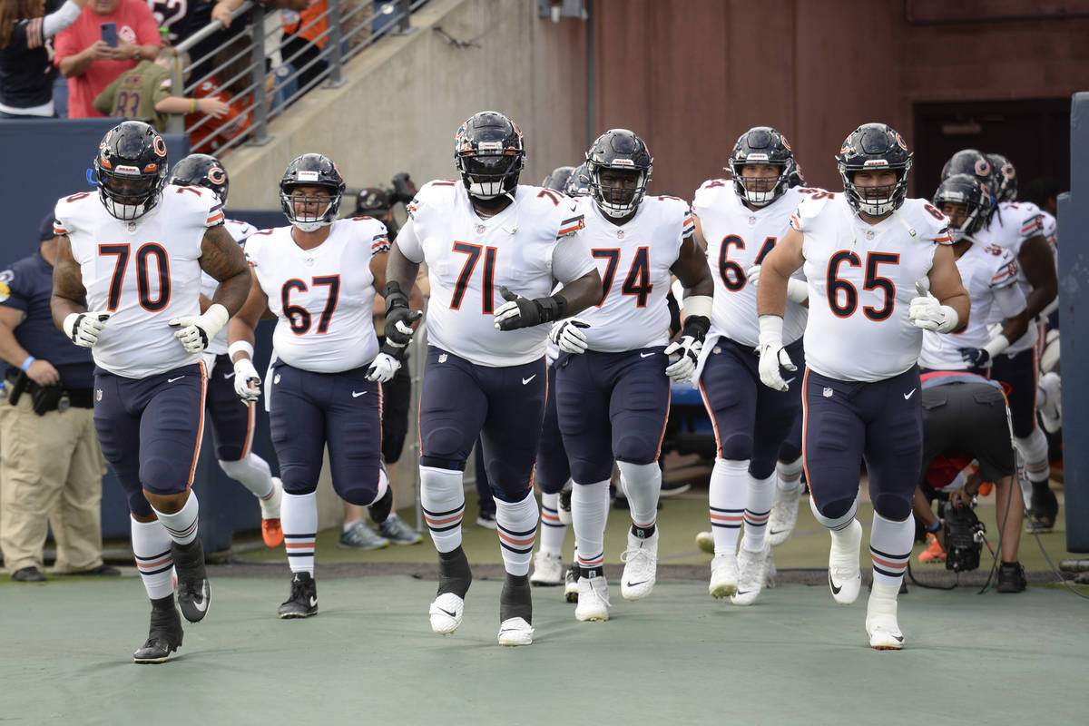 Chicago Bears players take the field for a preseason NFL football game against the Tennessee Ti ...
