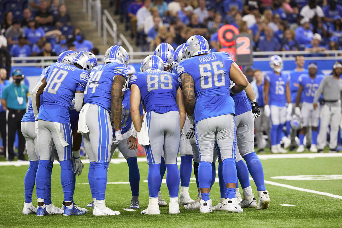 Detroit Lions offense huddles against Indianapolis Colts during an NFL preseason football game, ...