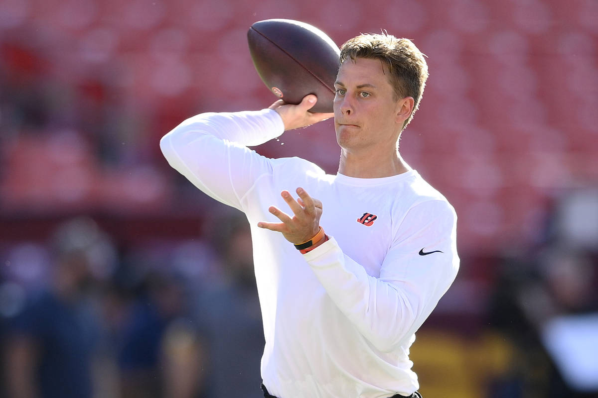 Cincinnati Bengals quarterback Joe Burrow works out before a preseason NFL football game agains ...