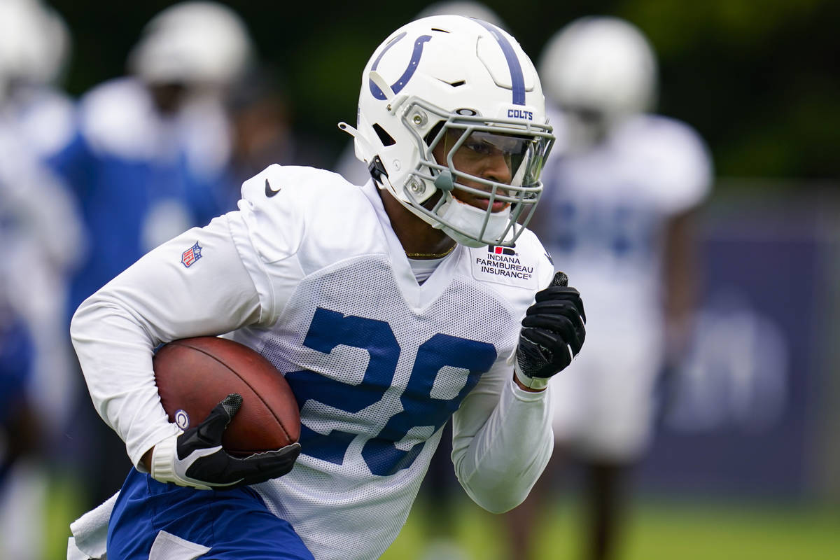 Indianapolis Colts running back Jonathan Taylor runs a drill during practice at the NFL team's ...