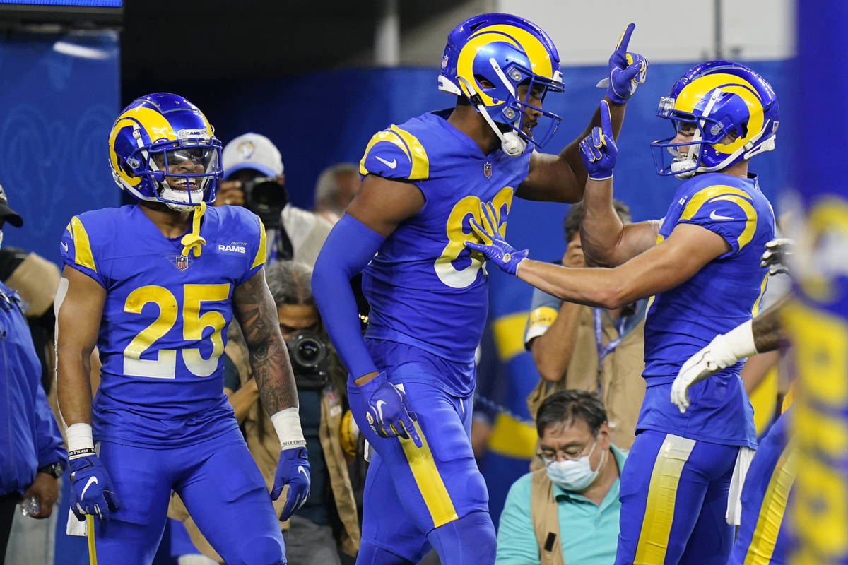 Los Angeles Rams tight end Kendall Blanton, center, celebrates his touchdown catch with teammat ...