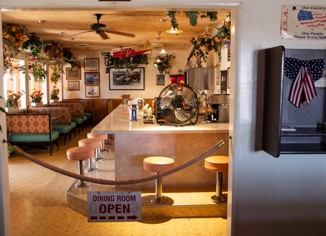 A dinning room and and a phone booth are seen inside Cal-Nev-Ari restaurant-casino, on Thursday ...