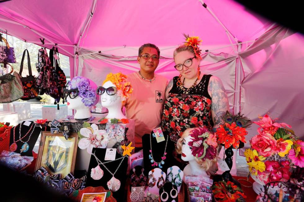 Madison Morassi De Los Reyes and her husband Joseph pose for a photo while selling items at the ...