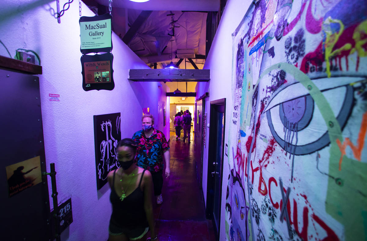 People explore the Arts Factory during First Friday in the Arts District of downtown Las Vegas ...