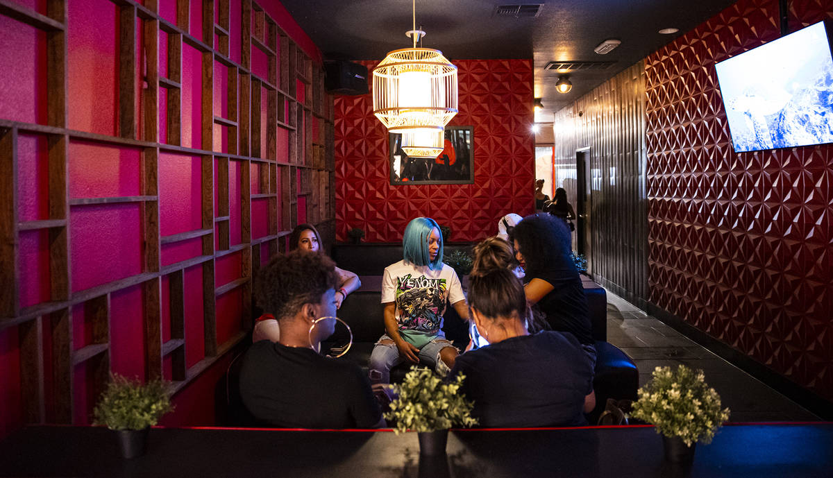 People hang out at Ninja Karaoke during First Friday in the Arts District of downtown Las Vegas ...