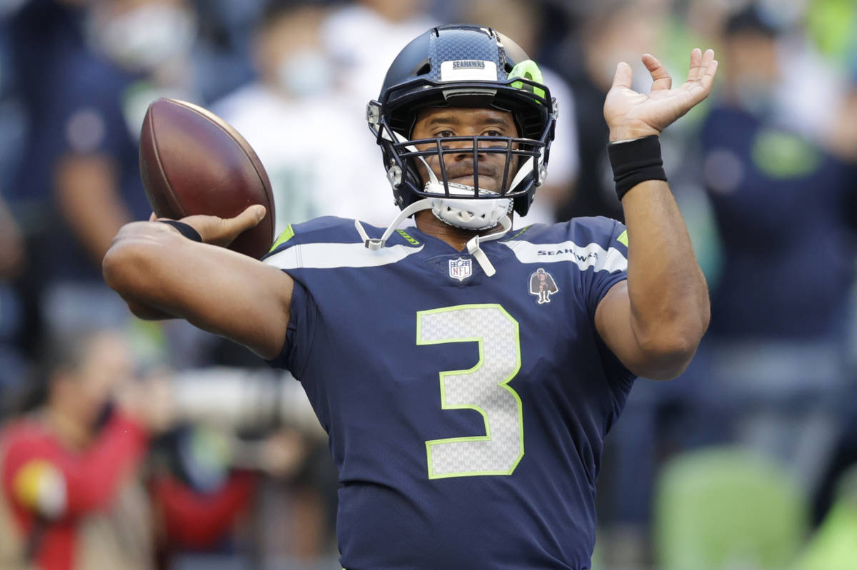 Seattle Seahawks quarterback Russell Wilson passes before an NFL football preseason game agains ...