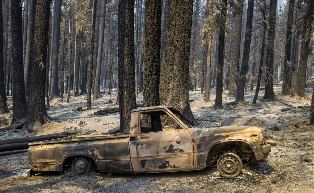 A burned-out pickup truck from the Caldor Fire on Thursday, Sept. 2, 2021, in Twin Bridges, Cal ...