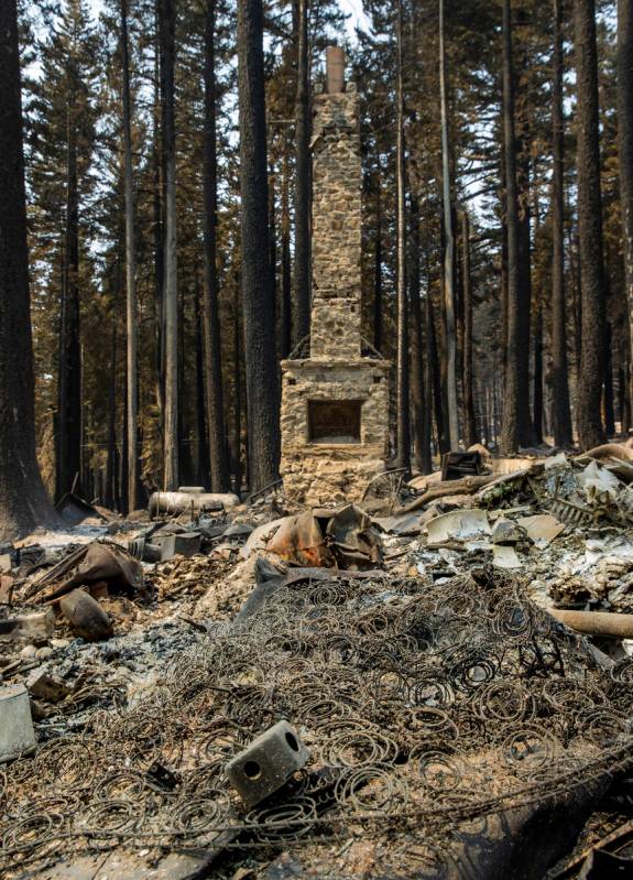 A bedspring and few other possessions remain but destroyed in a home from the Caldor Fire on Th ...