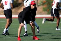 UNLV Rebels head coach Marcus Arroyo watches his players during football practice in UNLV, Wedn ...