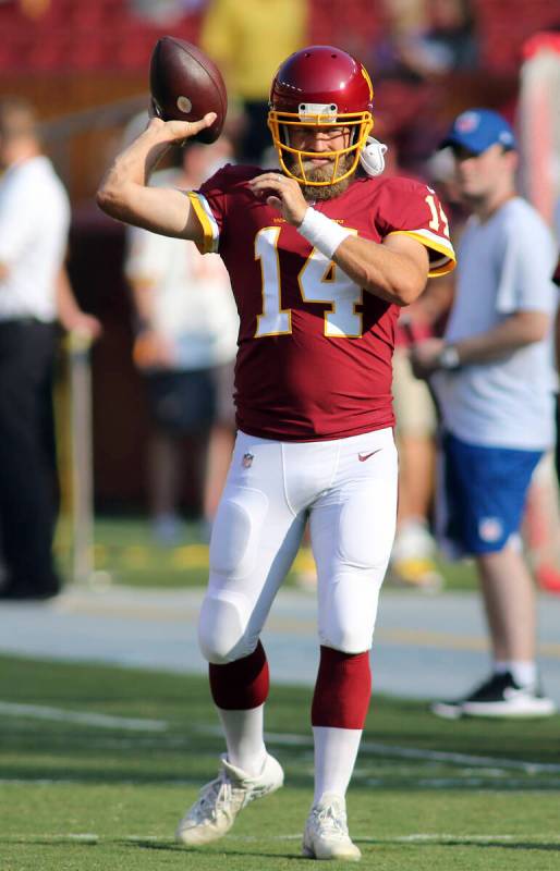 Washington Football Team quarterback Ryan Fitzpatrick (14) makes a throw before an NFL preseaso ...