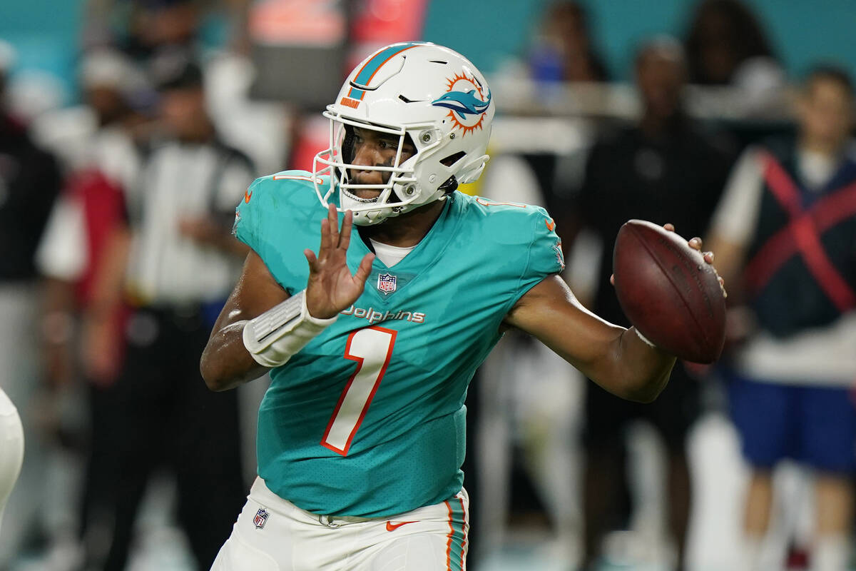 Miami Dolphins quarterback Tua Tagovailoa (1) aims a pass during the first half of a NFL presea ...