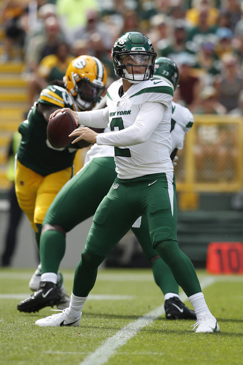 New York Jets' Zach Wilson looks to throw a pass during the first half of a preseason NFL footb ...