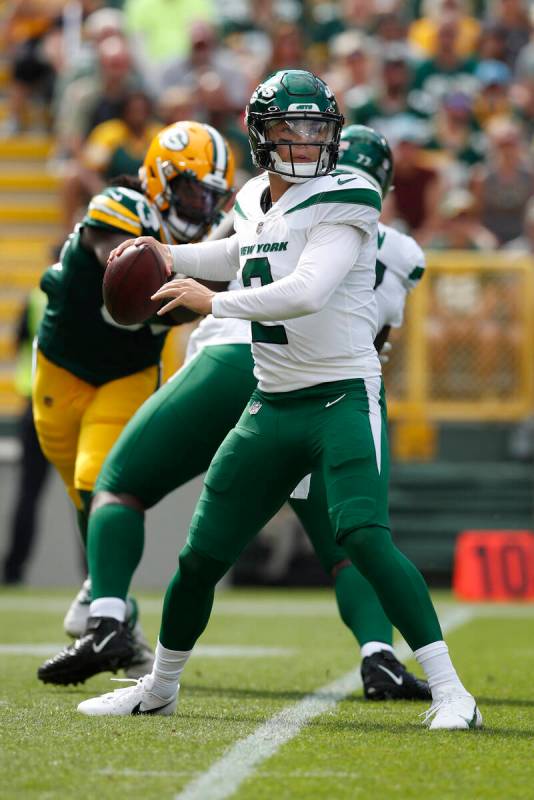 New York Jets' Zach Wilson looks to throw a pass during the first half of a preseason NFL footb ...