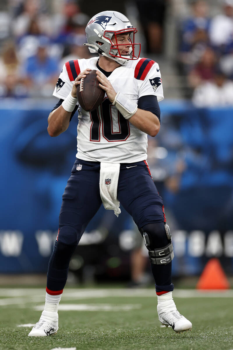 New England Patriots quarterback Mac Jones (10) in action against the New York Giants during an ...