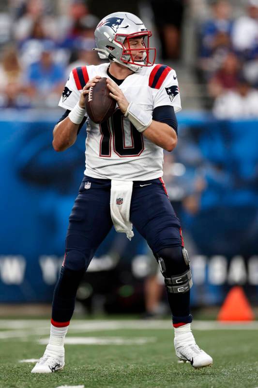 New England Patriots quarterback Mac Jones (10) in action against the New York Giants during an ...