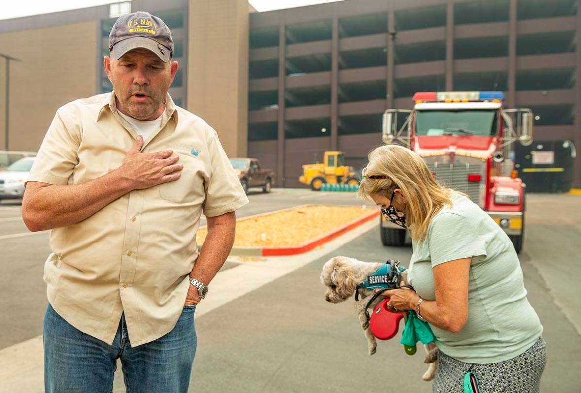 Jim, left, and Alicia Halloran with dog Billy Budd prepare to leave from the Montbleu Resort, C ...