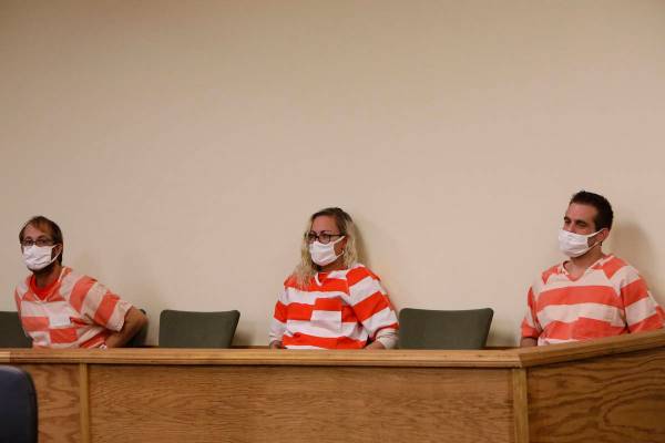 Brad Mehn, from left, Heather Pate and Kevin Dent attend a hearing at Pahrump Justice Court on ...