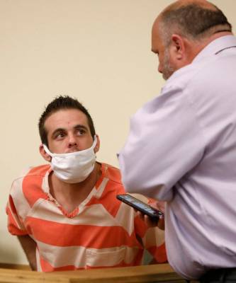 Kevin Dent, left, listens to his attorney, Jason Earnest, during a hearing at Pahrump Justice C ...