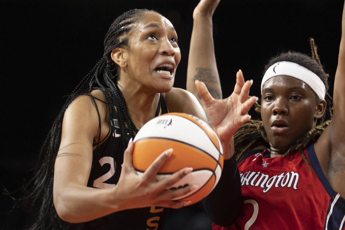 Las Vegas Aces forward A'ja Wilson (22) drives past Washington Mystics forward Myisha Hines-All ...