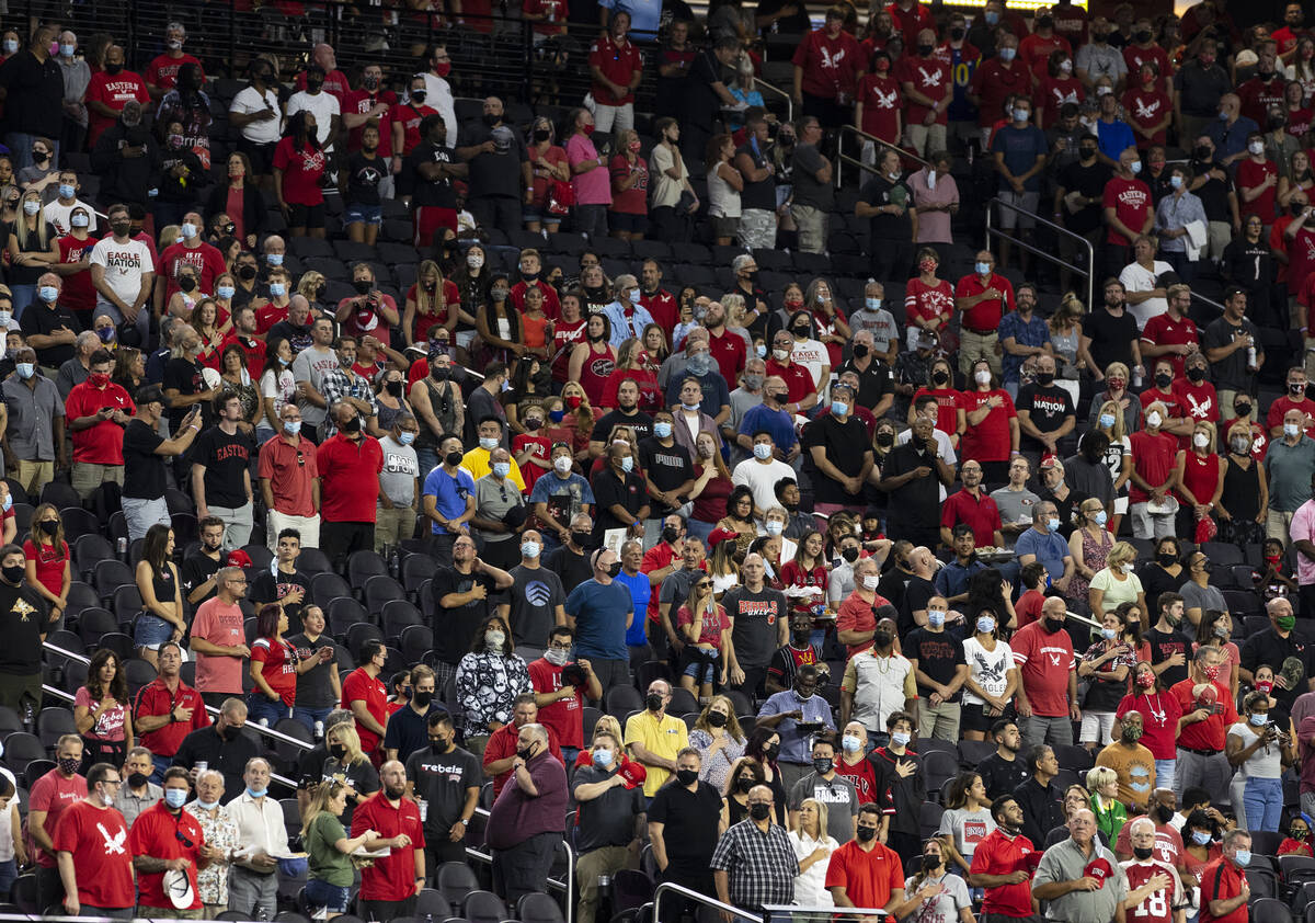 Fans stand during the National Anthem before an NCAA football game between UNLV Rebels and East ...