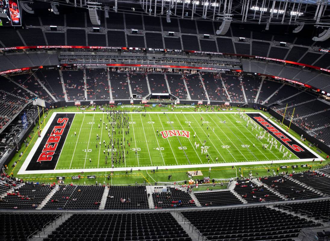 UNLV Rebels and Eastern Washington University players warm up before an NCAA football game at A ...