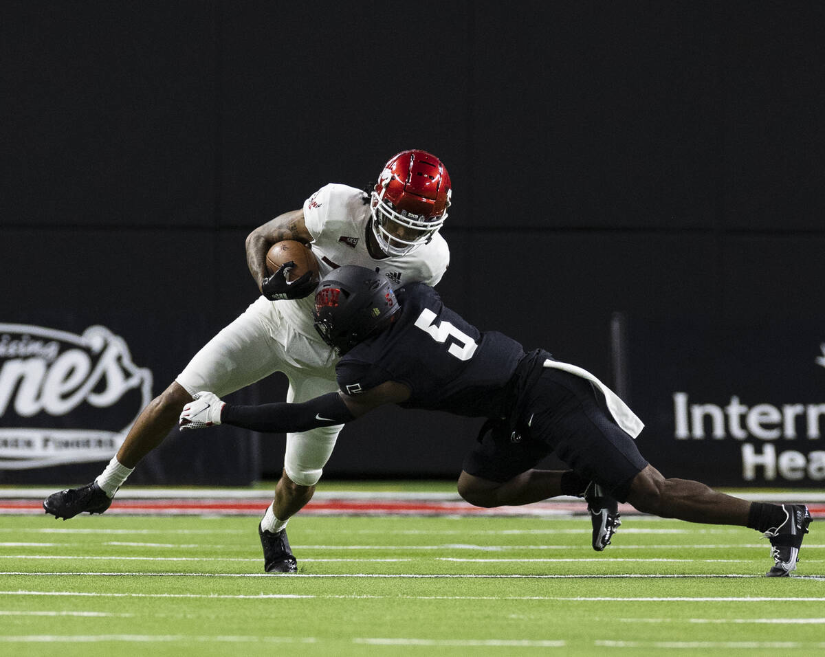 UNLV Rebels defensive back Phillip Hill (5) tackles Eastern Washington UniversityÕs wide r ...