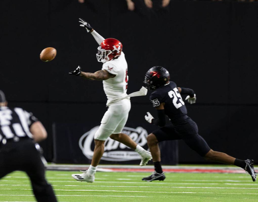 UNLV Rebels defensive back Cameron Oliver (25) deflects the ball that was intended to Eastern W ...