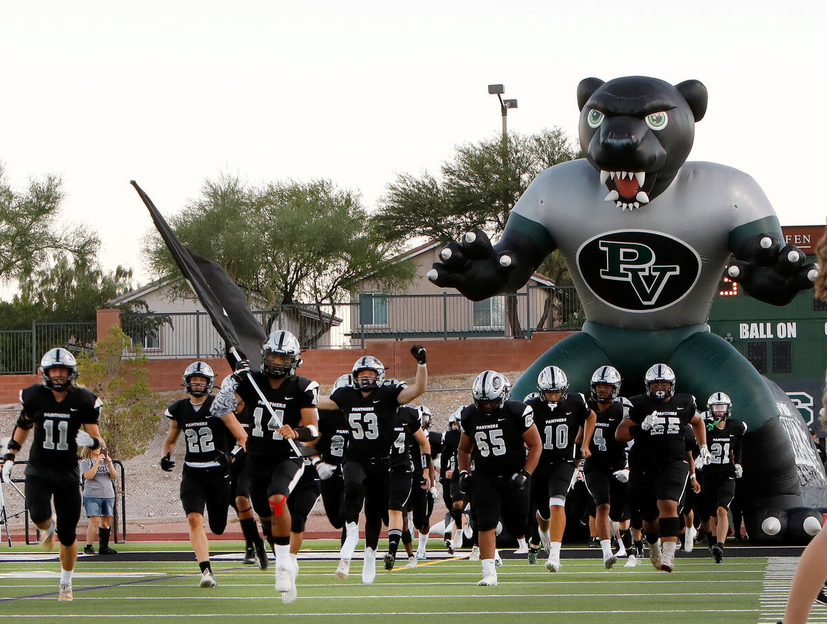 Palo Verde High School's players runs into the field before a football game against Green Valle ...
