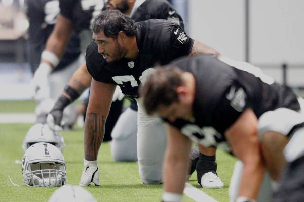 Raiders offensive lineman Jeremiah Poutasi (79) stretches during team practice at the Raiders H ...