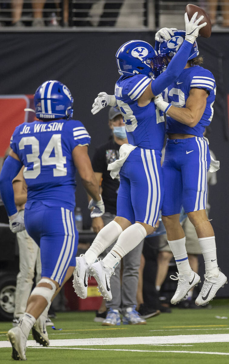 Brigham Young Cougars defensive back Hayden Livingston (28) celebrates with Brigham Young Couga ...