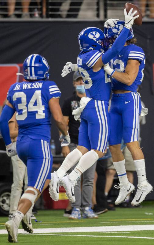 Brigham Young Cougars defensive back Hayden Livingston (28) celebrates with Brigham Young Couga ...