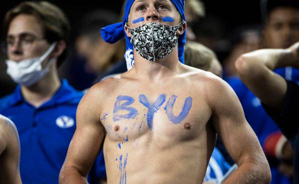 BYU fans cheer for the Cougars in the first quarter during a college football game against the ...
