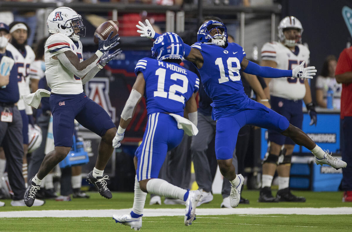 Arizona Wildcats wide receiver BJ Casteel (5) makes a catch over Brigham Young Cougars defensiv ...