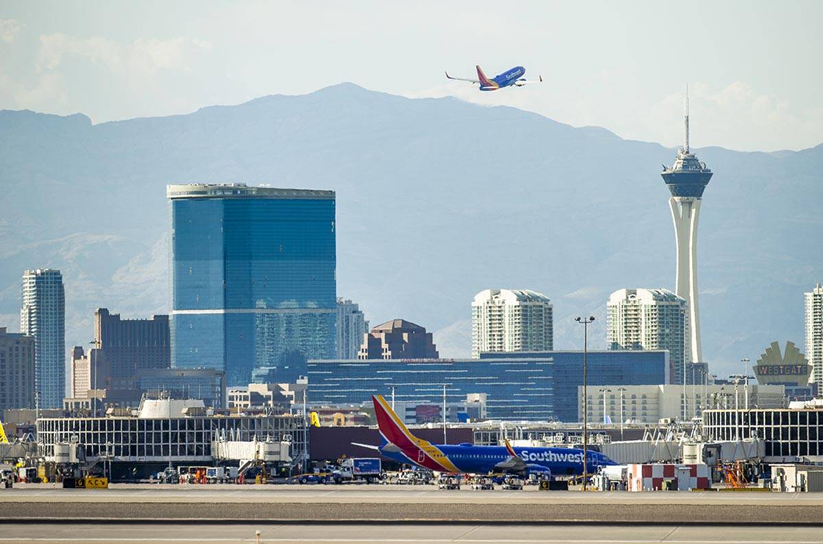 A Southwest plane departs as heat is causing travel delays at McCarran International Airport on ...