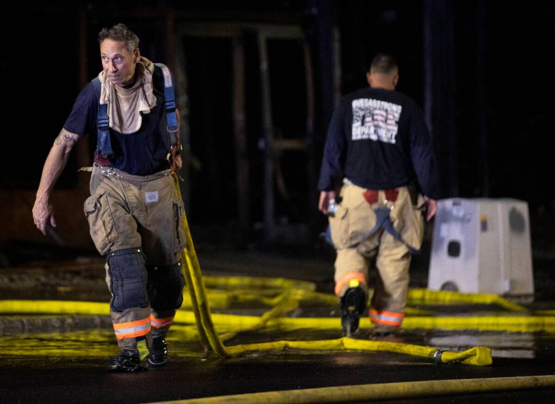 The Las Vegas Fire Department responds to the aftermath of a fire at 1026 S. Main Street on Sun ...