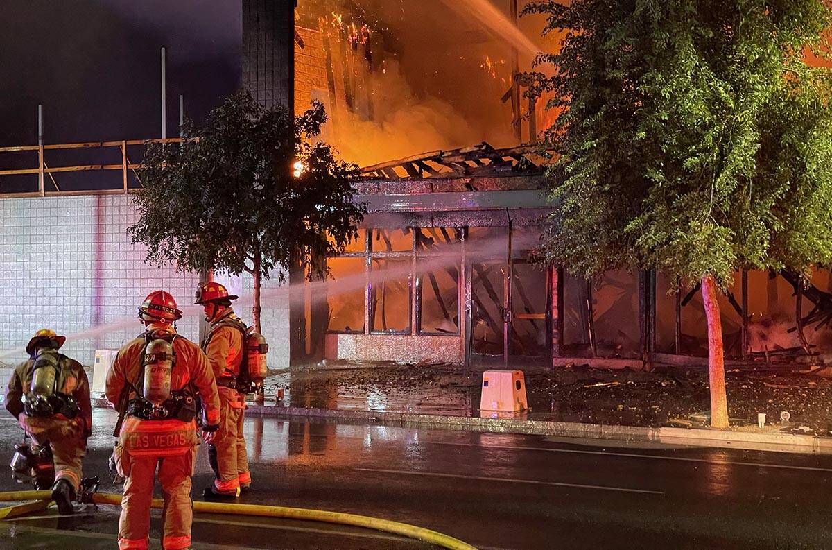 Firefighters extinguish a building fire on Commerce Street in downtown Las Vegas on Sunday, Sep ...