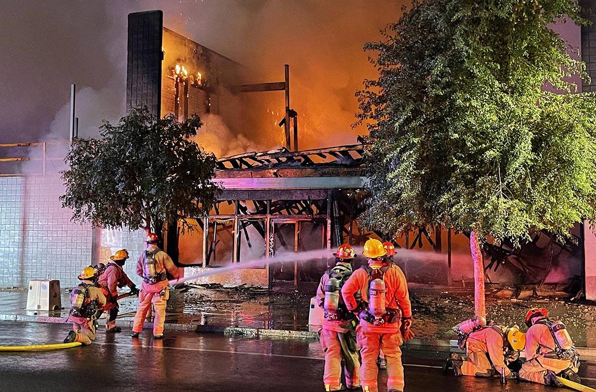 Firefighters extinguish a building fire on Commerce Street in downtown Las Vegas on Sunday, Sep ...